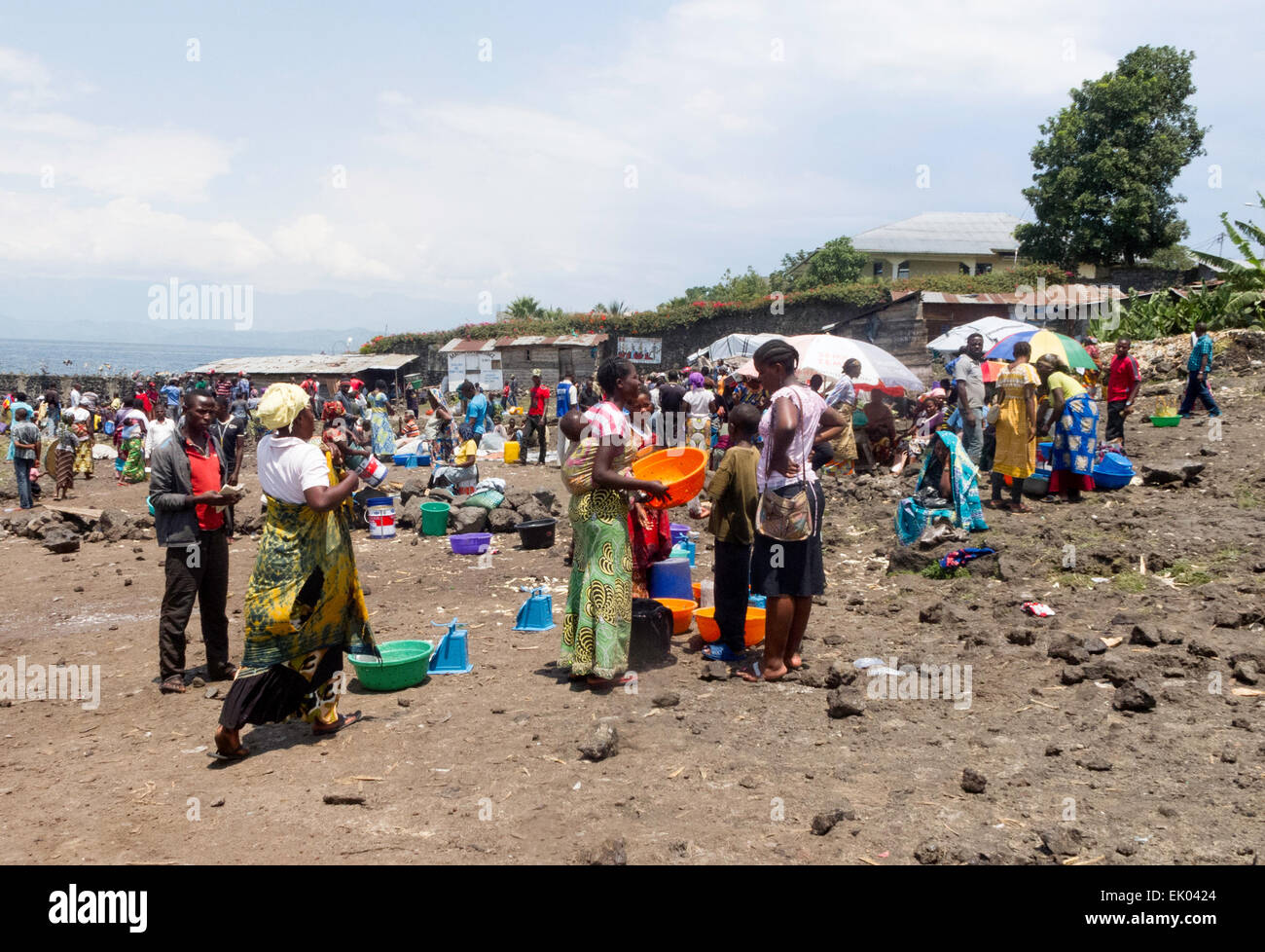 Local people shopping and buying fish when the fishermen come in; Lake Kivu, Goma, Democratic Republic of Congo ( DRC ) Africa Stock Photo