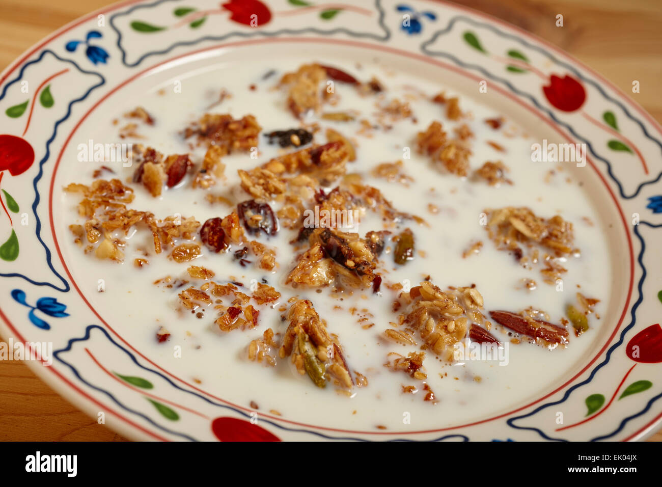 bowl of granola cereal with milk Stock Photo Alamy