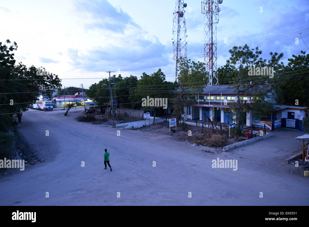 Garissa, Kenya. 3rd Apr, 2015. A man walks on an empty street shortly after a curfew is in effect in Garissa, Kenya, April 3, 2015. A two-week-long curfew was imposed from Friday on Carissa and three other counties in northeastern Kenya. Credit:  Sun Ruibo/Xinhua/Alamy Live News Stock Photo