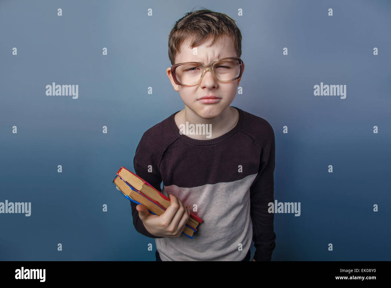 Boy in school reading; glasses hires stock photography and images Alamy