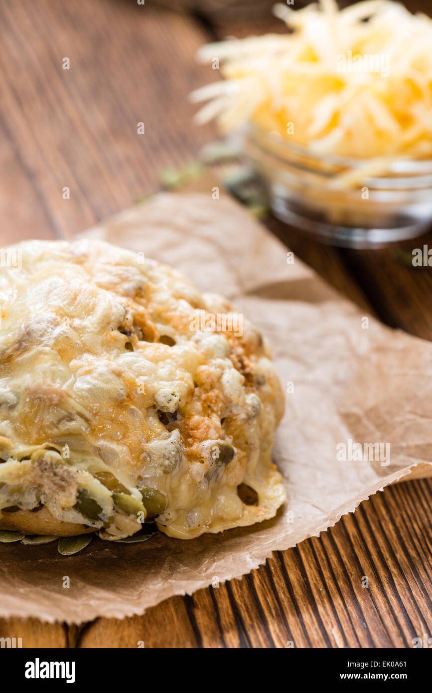 Bun gratinated with Cheese on rustic wooden background Stock Photo Alamy