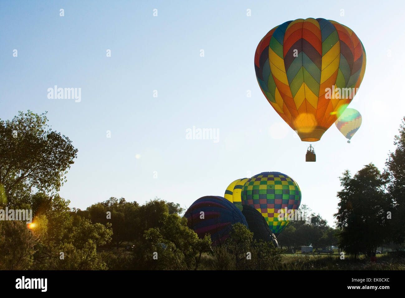 Balloons rising into the sky hi-res stock photography and images - Alamy