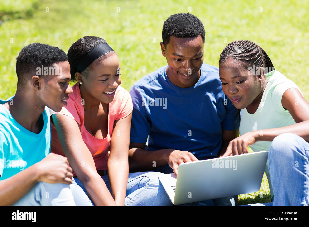 group of African university students using laptop outdoors Stock Photo ...