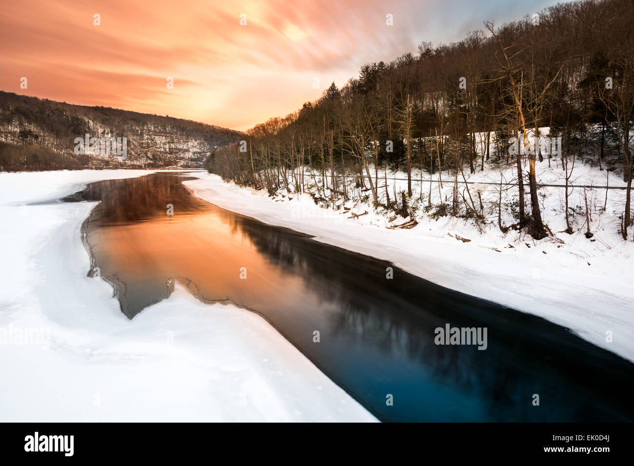 Sunset on a frozen Delaware river near Pond Eddy, New York Stock Photo