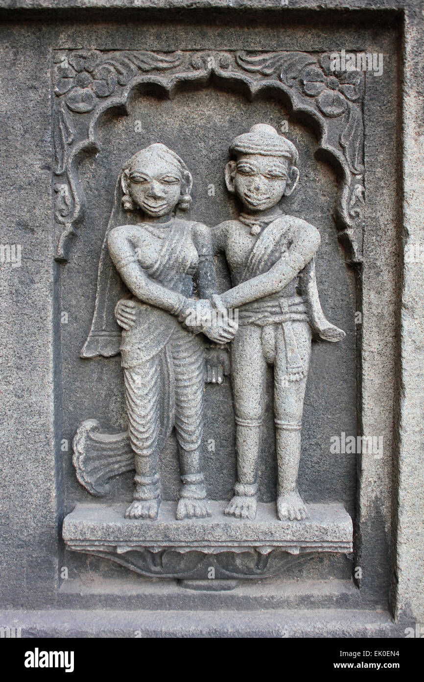 Sculpture of the couple on the outer walls of Shiva temple. Ahilyabai Holkar fort, Maheswar, Khargone, Madhya Pradesh, India Stock Photo
