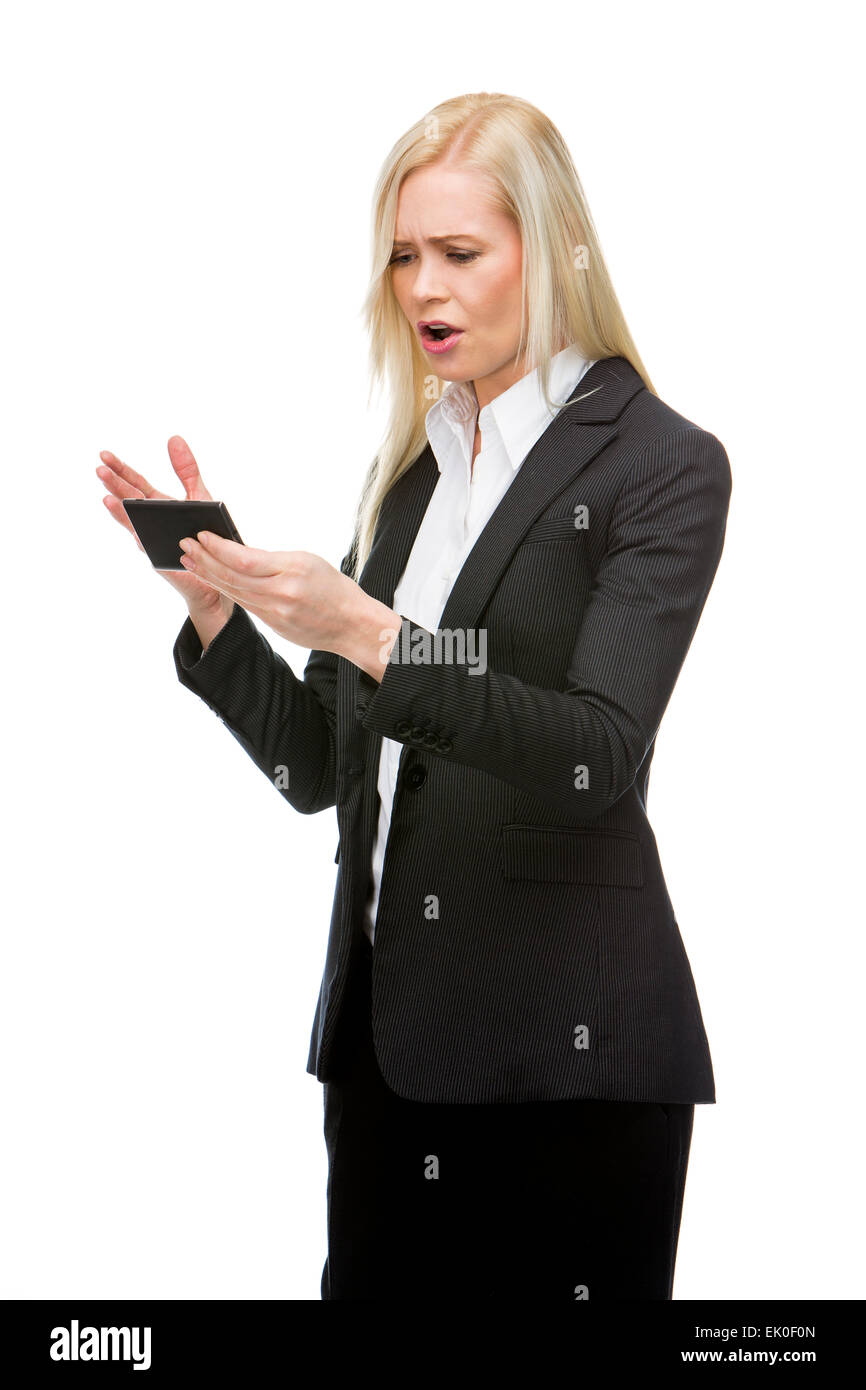 angry blonde businesswoman shouting at mobile phone Stock Photo