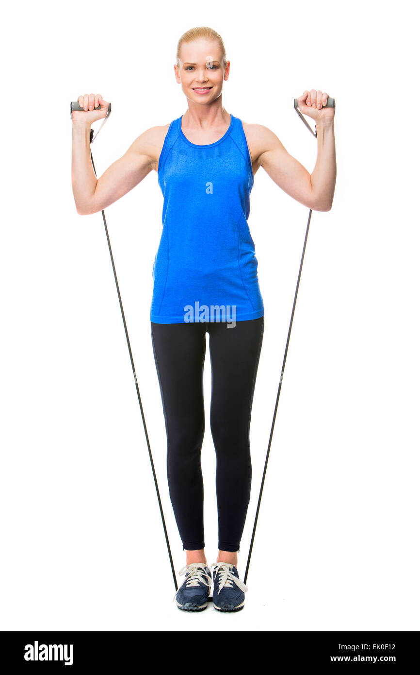 blonde woman wearing fitness clothing exercising with rubber band Stock Photo