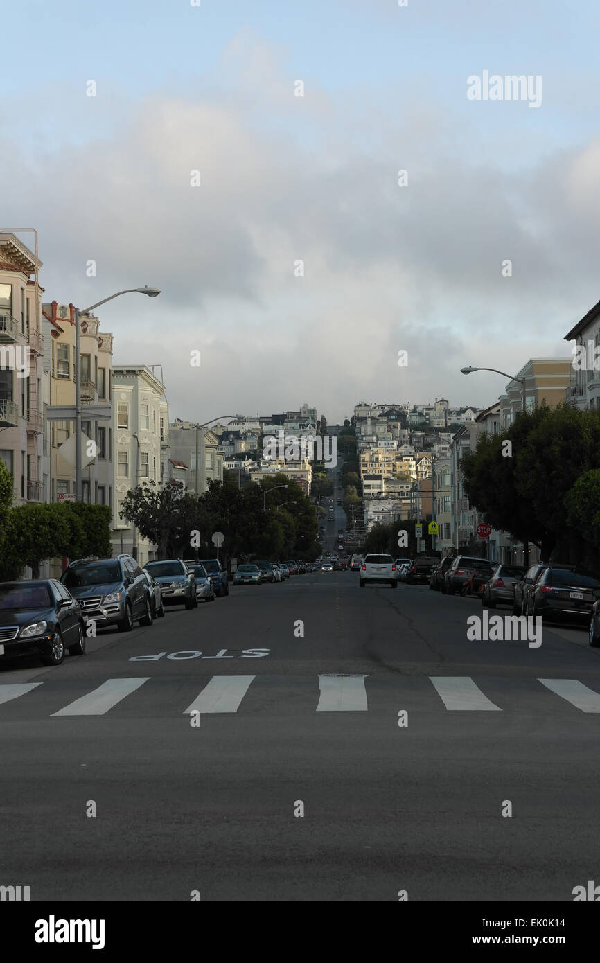 Blue sky grey clouds portrait, from Marina Boulevard, houses, parked cars Divisadero Street to Pacific Heights, San Francisco Stock Photo