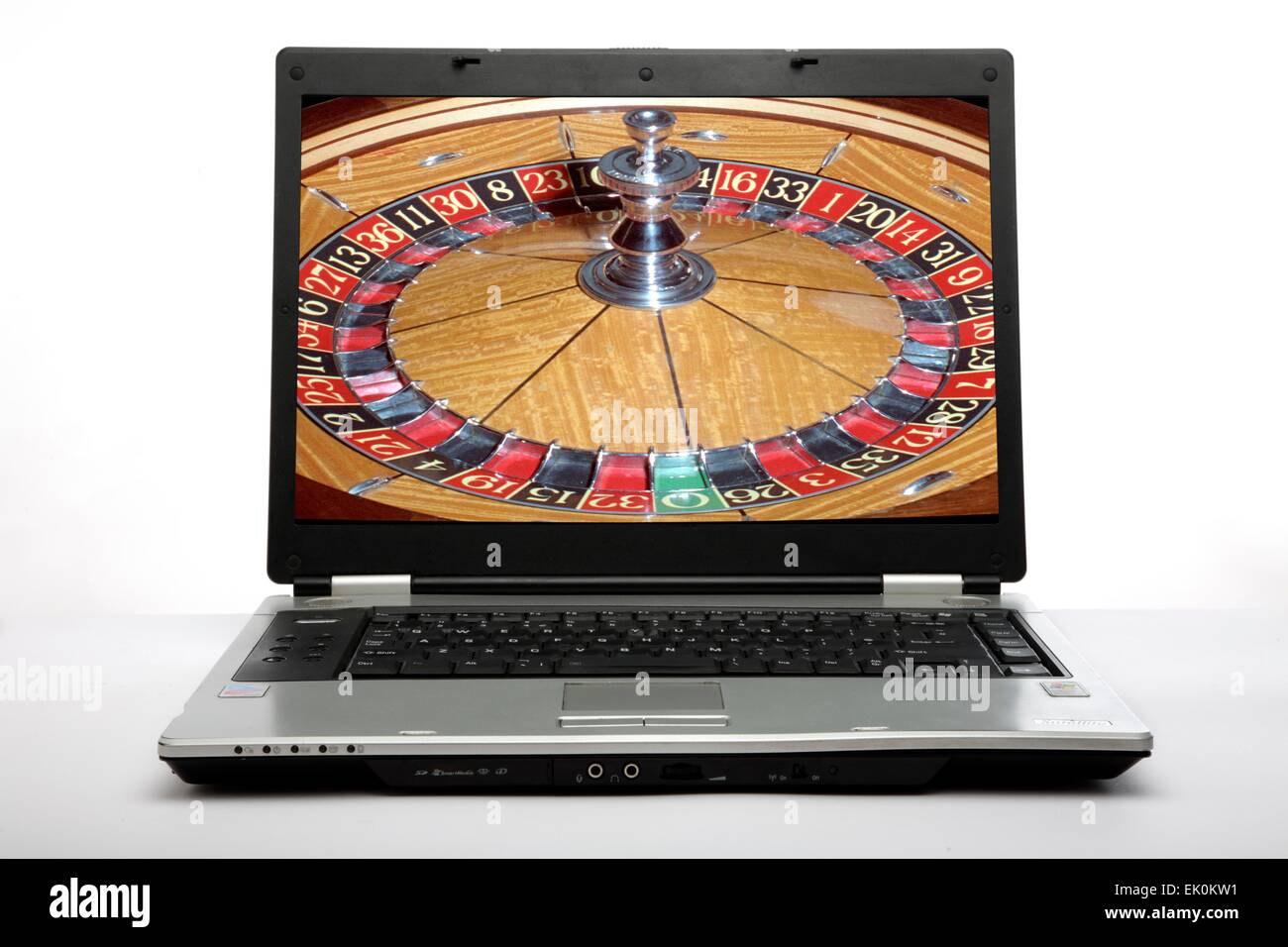 nobody, no one, no-one, laptop, computer, technology, technological, online gambling, roulette wheel, playing, game, gambling, risk, chance, plain background, white background Stock Photo