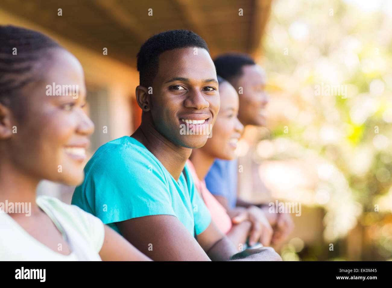 good looking African American college boy with group of friends Stock Photo