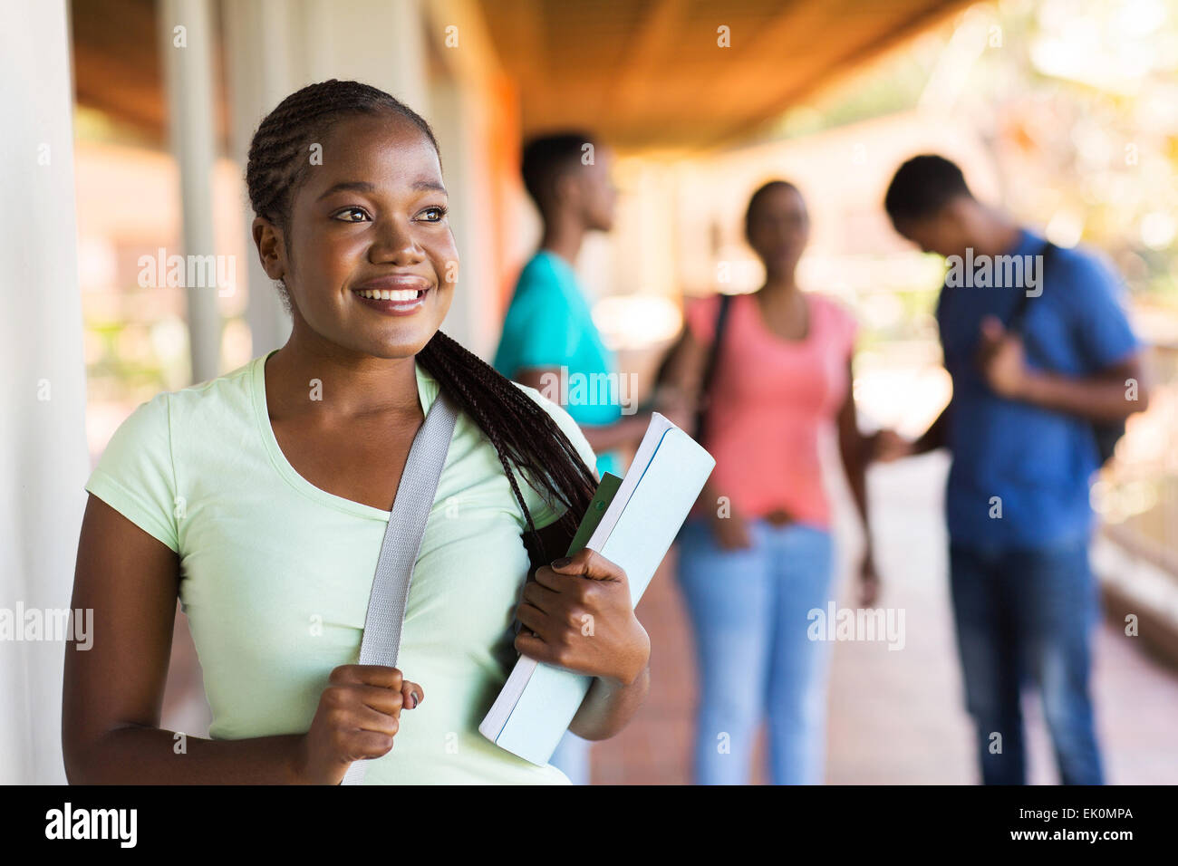 beautiful African college girl looking away Stock Photo - Alamy