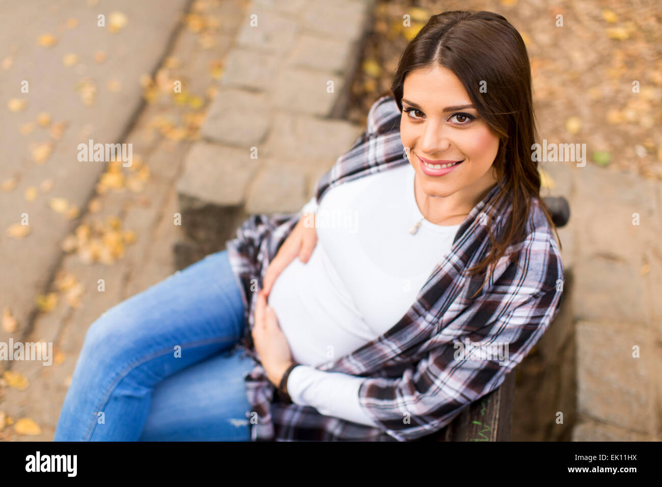 Young pregnant woman in the autumn park Stock Photo - Alamy