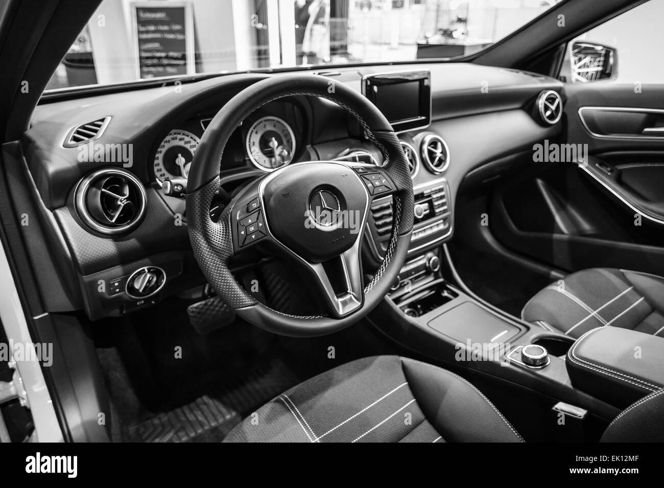BERLIN - JANUARY 24, 2015: Showroom. Interior of a compact car Mercedes-Benz A200 CGI BE. Black and white. Produced since 2013. Stock Photo
