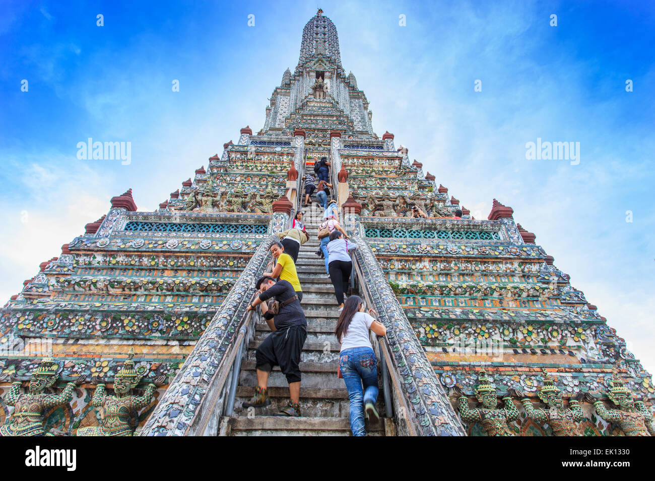 People climbing the Wat Arun Temple Stock Photo
