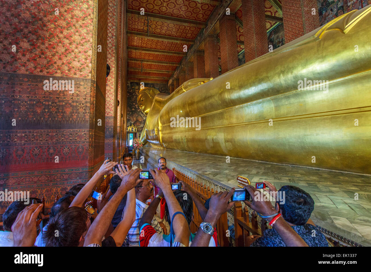People tacking picture inside the Wat Pho temple, Bangkok Stock Photo ...