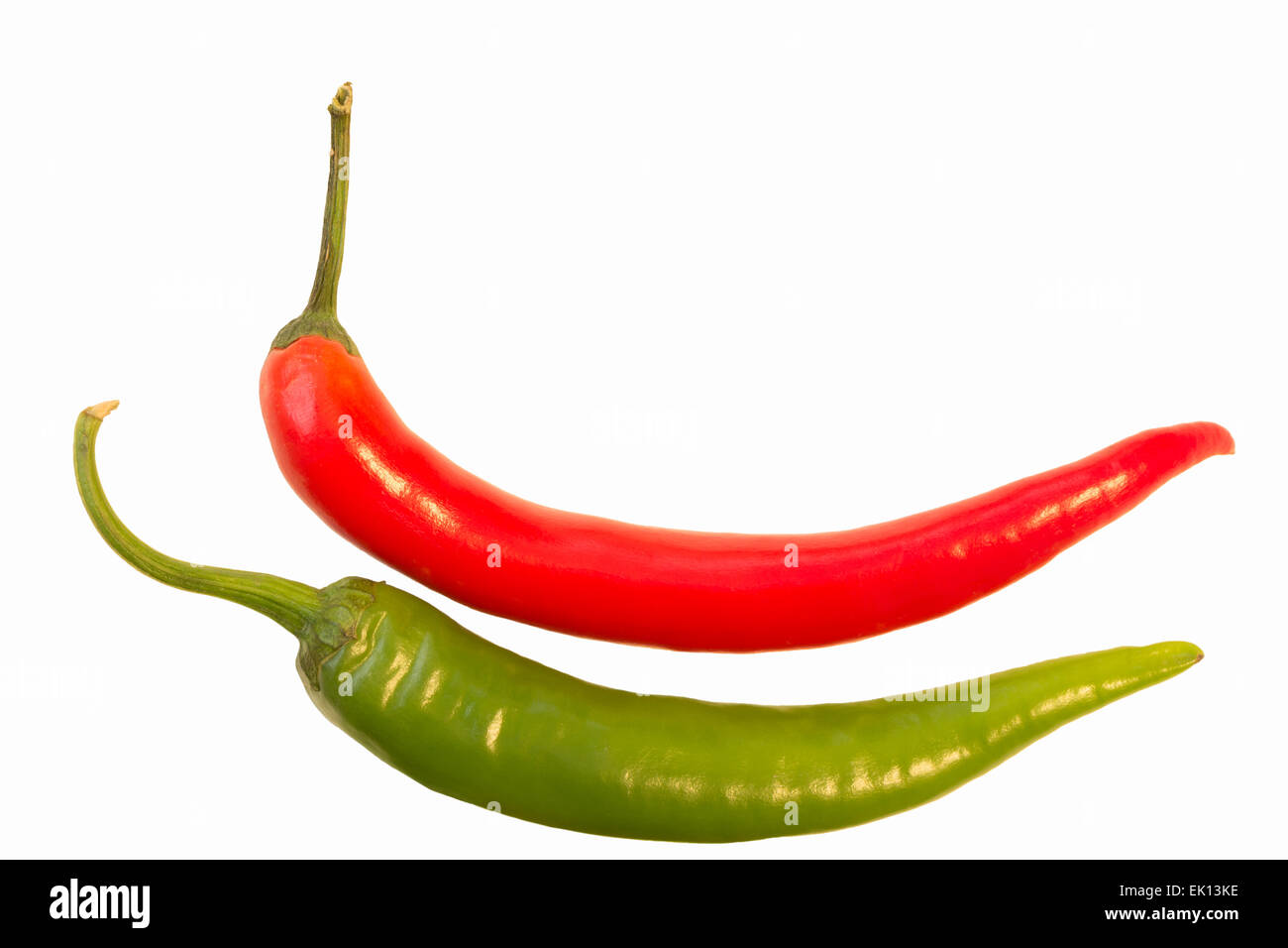 Closeup of a whole red and green chili (Capsicum annuum) isolated on white background Stock Photo