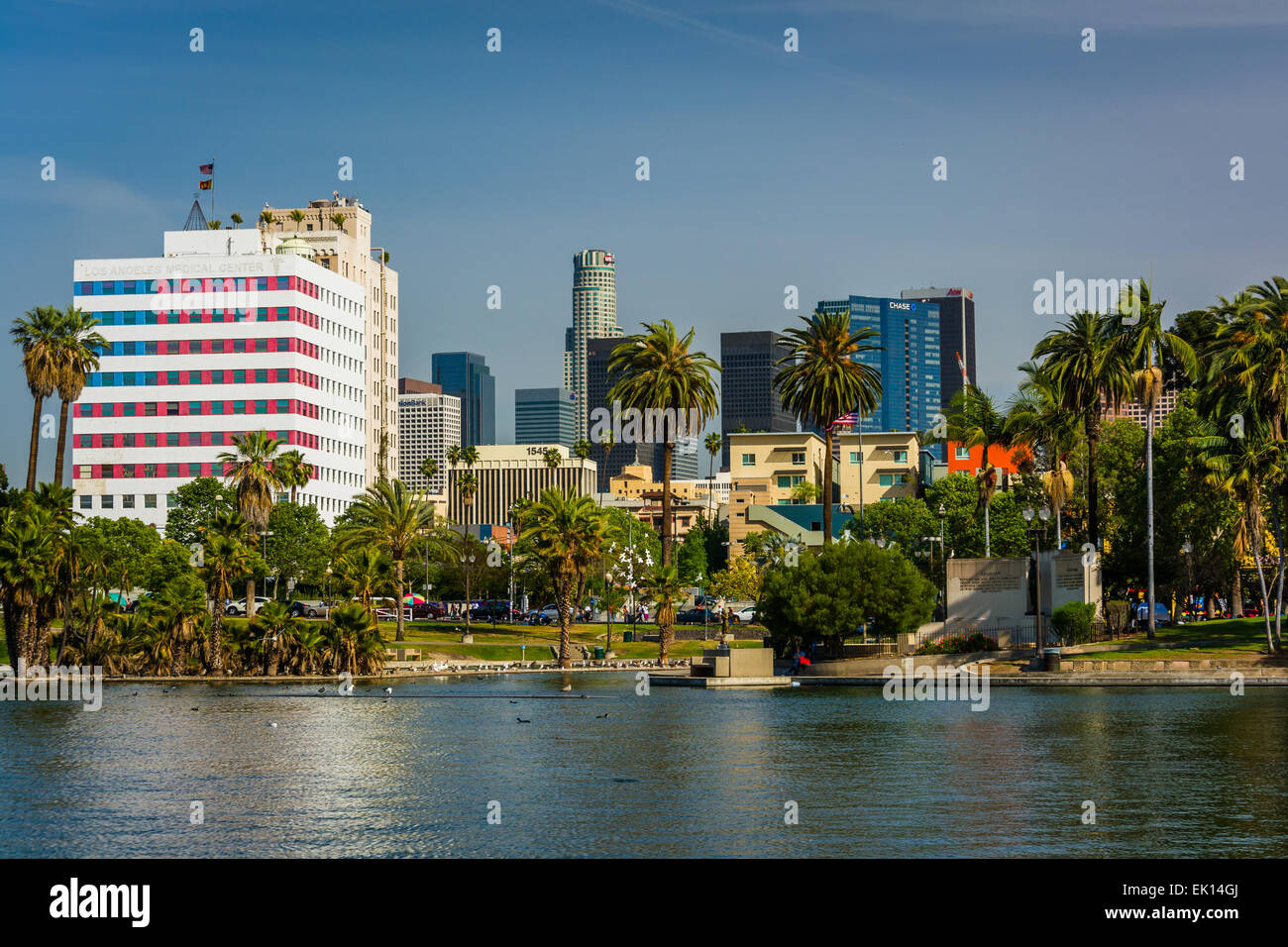 The Los Angeles skyline and the lake at MacArthur Park, in Westlake