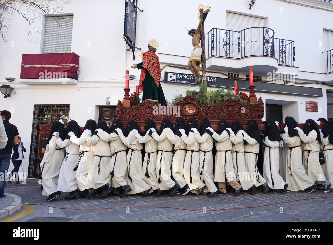 Hooded men carrying float during Procession, Holy week, semana santa