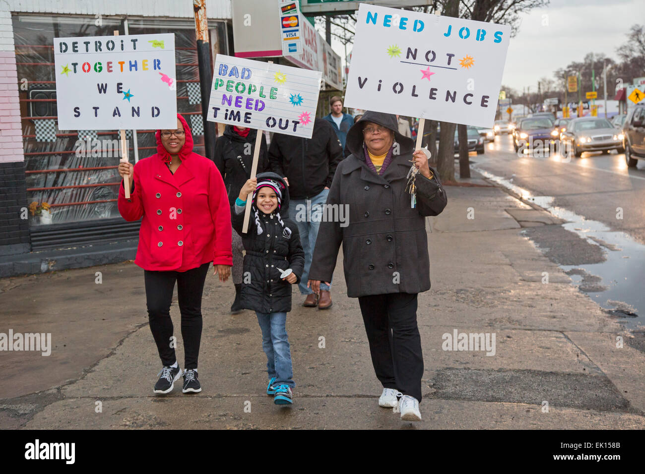 Detroit, Michigan USA - Members of Gesu Catholic Church and residents of the surrounding neighborhood joined in a Good Friday Peace Walk. The event was a reaction to the recent shooting of Federal Judge Terrence Berg, a member of the church and resident of the neighborhood, in an attempted robbery. Credit:  Jim West/Alamy Live News Stock Photo