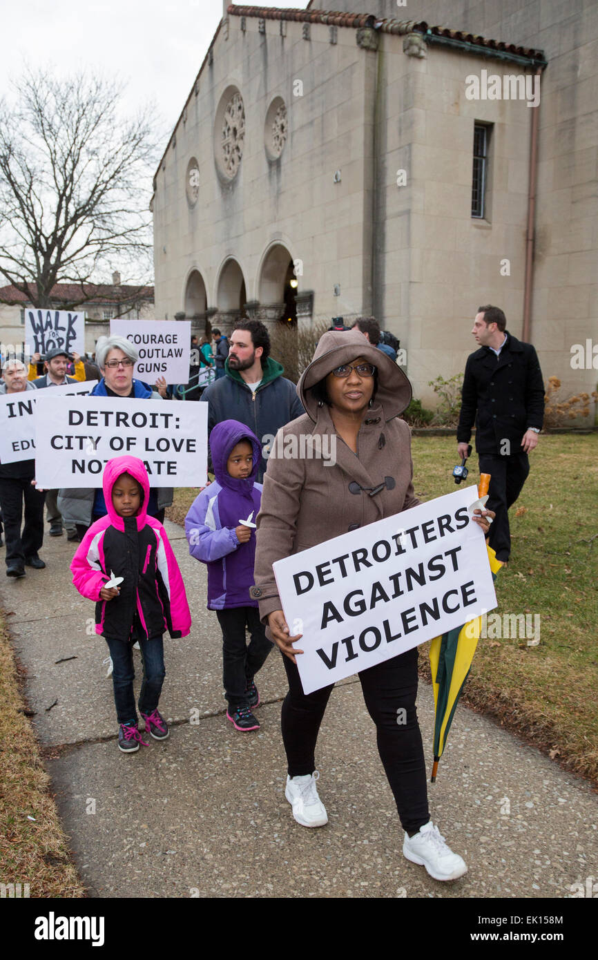 Detroit, Michigan USA - Members of Gesu Catholic Church and residents of the surrounding neighborhood joined in a Good Friday Peace Walk. The event was a reaction to the recent shooting of Federal Judge Terrence Berg, a member of the church and resident of the neighborhood, in an attempted robbery. Credit:  Jim West/Alamy Live News Stock Photo