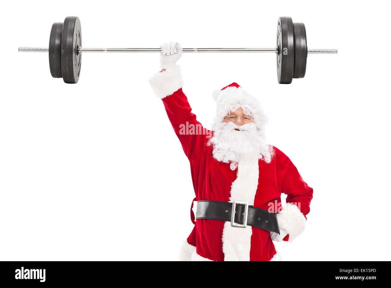 Smiling Santa holding a heavy barbell in one hand and looking at camera isolated on white background Stock Photo