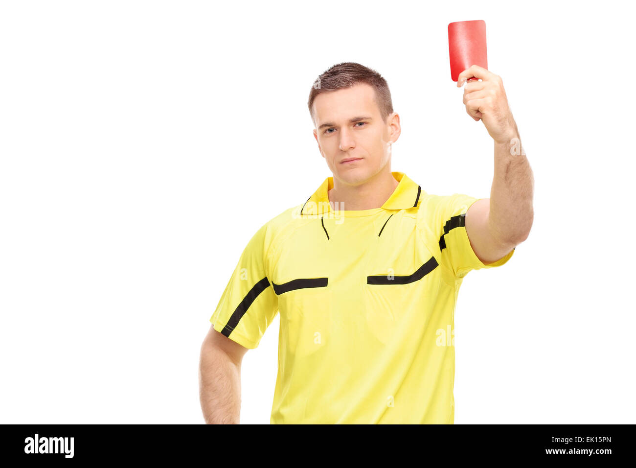 Strict football referee standing and showing a red card isolated on