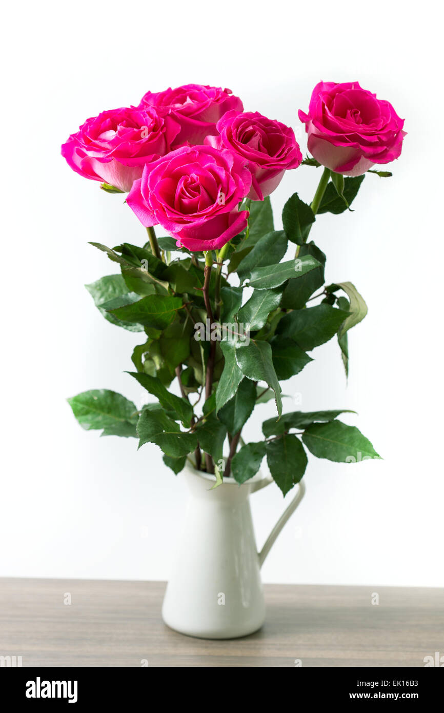 Bouquet of beautiful pink roses on white background Stock Photo - Alamy