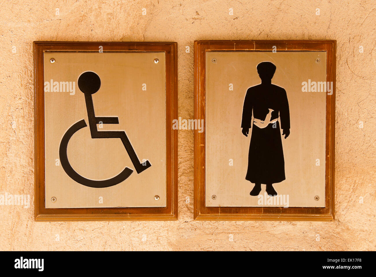 Signs outside men's toilet, Nizwa, Oman Stock Photo