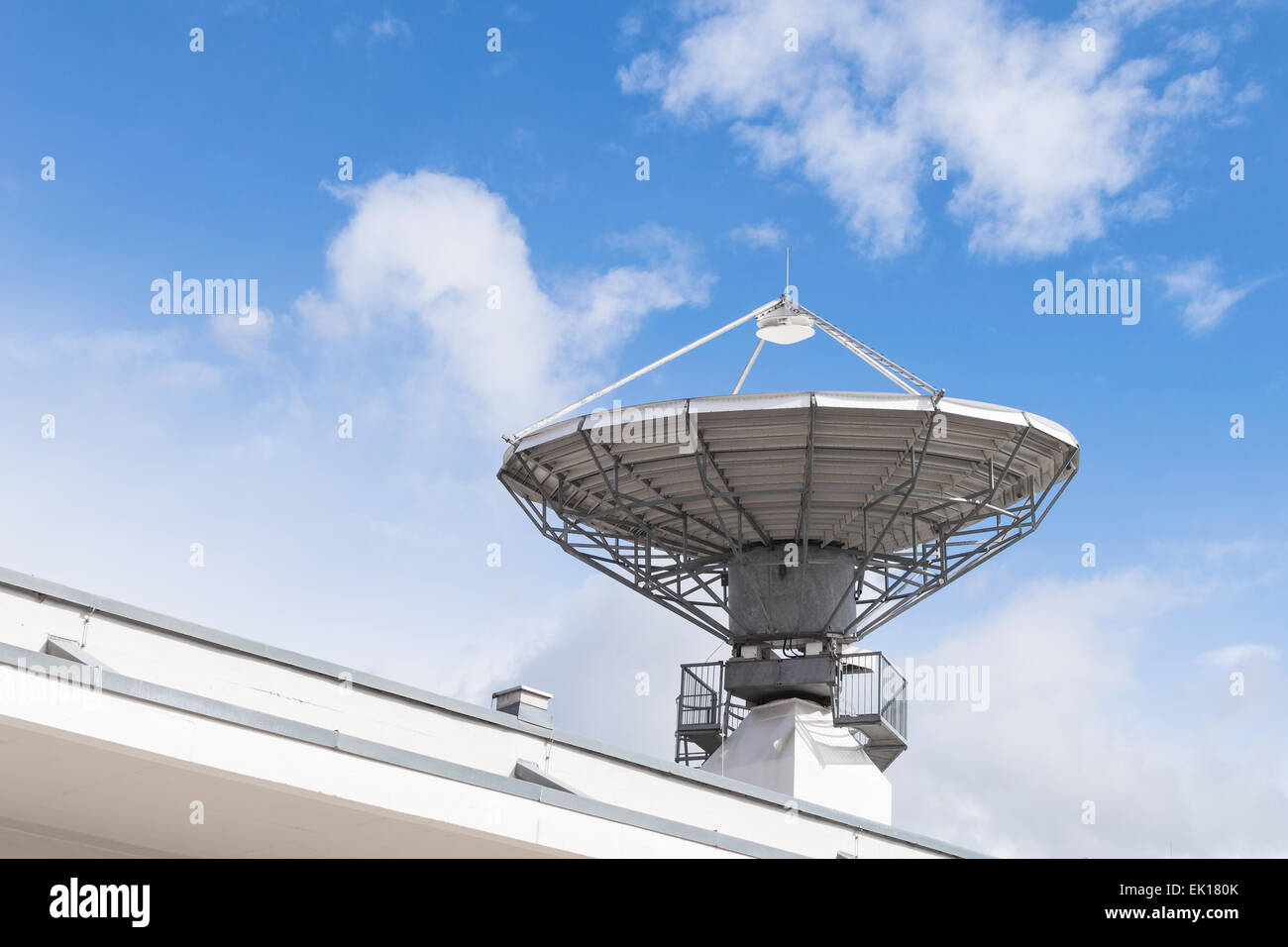 Military radiolocator station with parabolic radar antenna dish is part of missile defense antimissile system Stock Photo