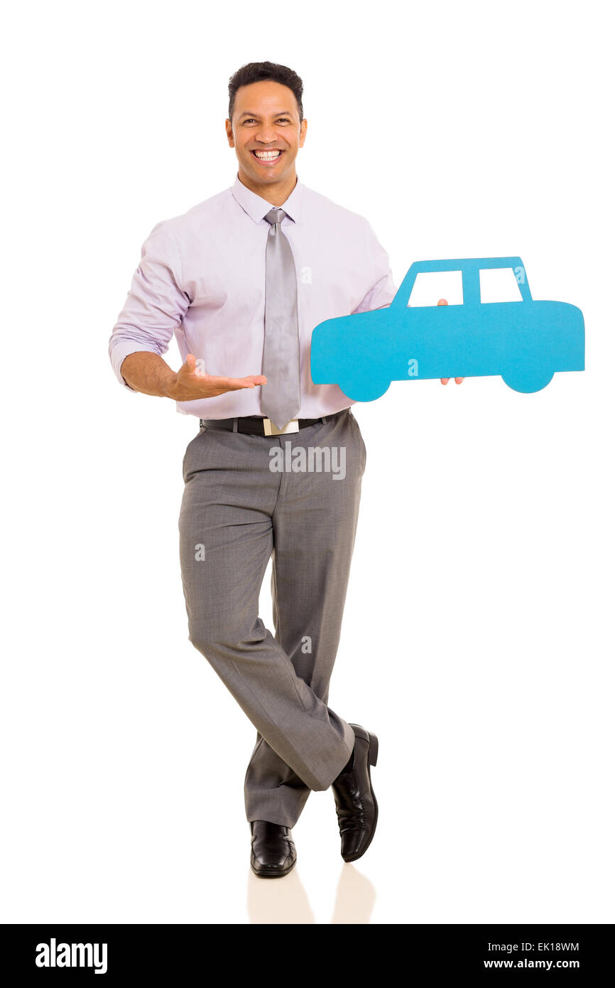 cheerful mid age man presenting paper car isolated on white background Stock Photo