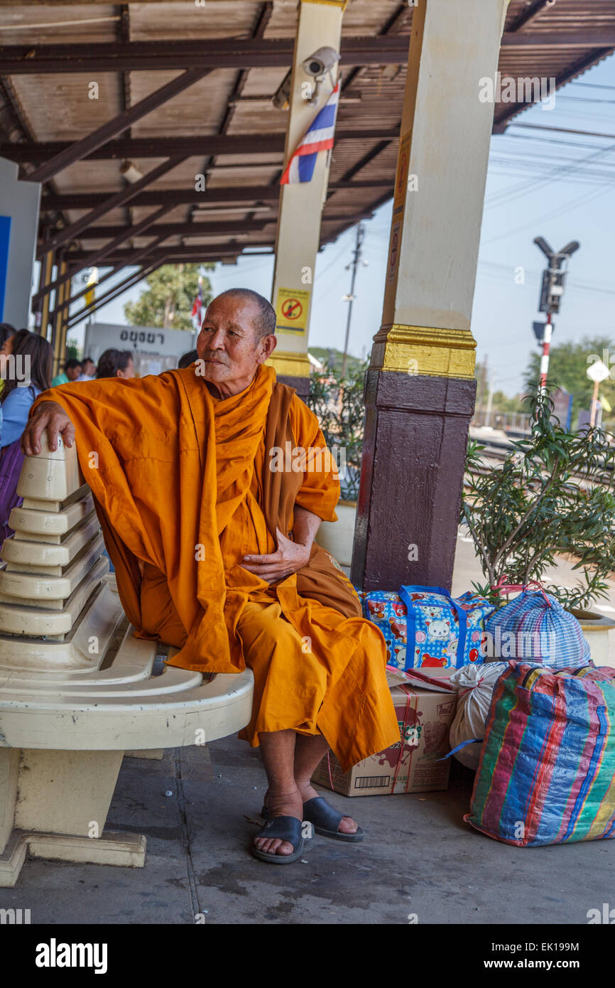 Monk waiting for the train at Ayutthaya station Stock Photo