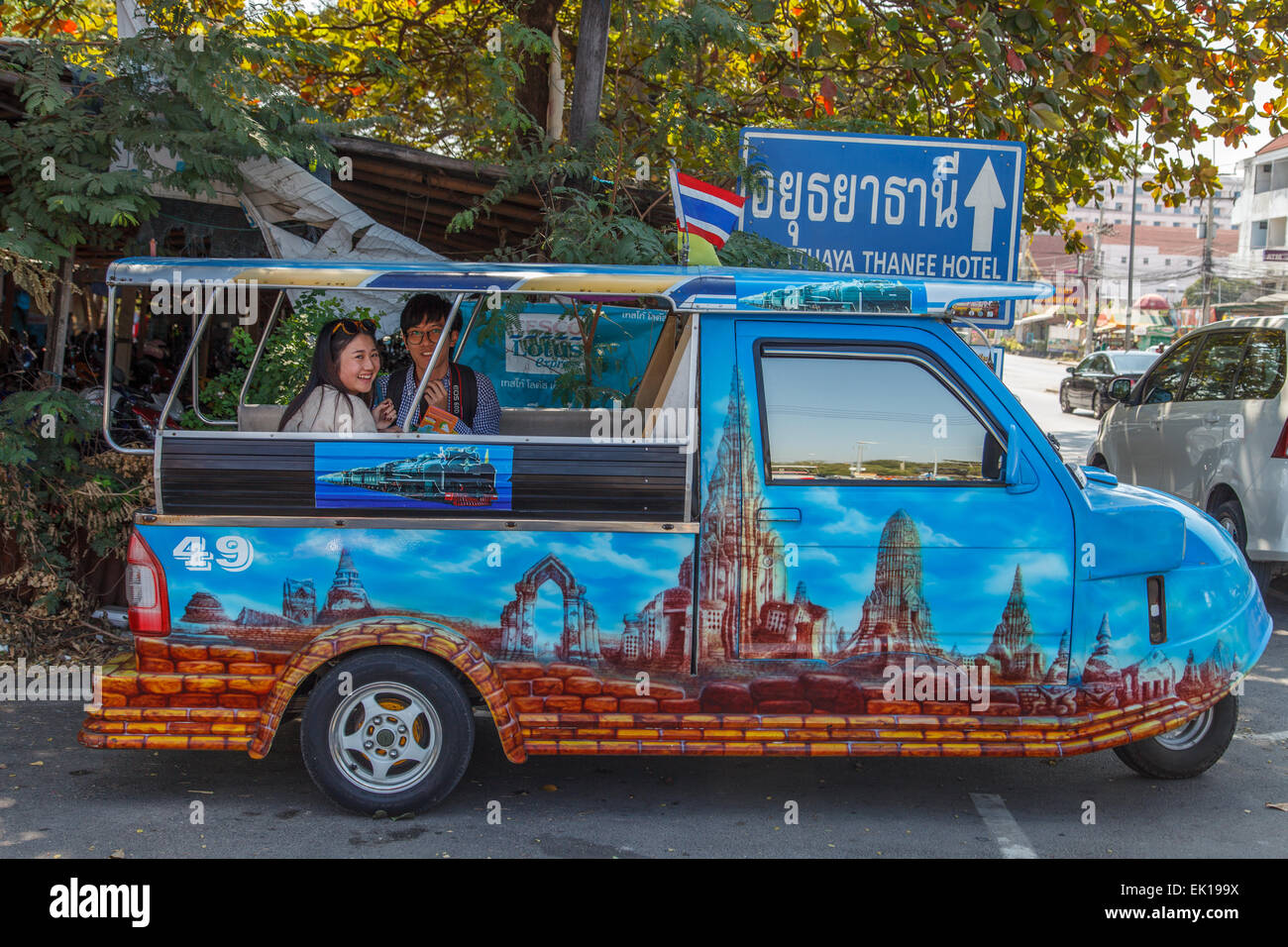 A couple of chinese tourists on a tuk tuk Stock Photo