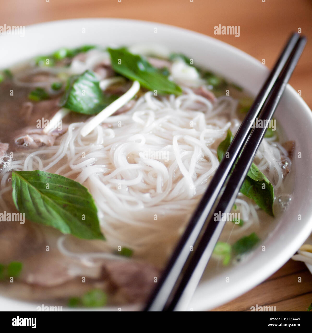 A bowl of beef brisket pho, a popular Vietnamese noodle soup. Stock Photo