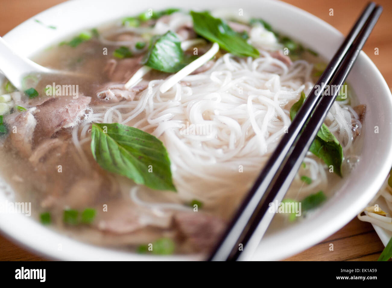 A bowl of beef brisket pho, a popular Vietnamese noodle soup. Stock Photo