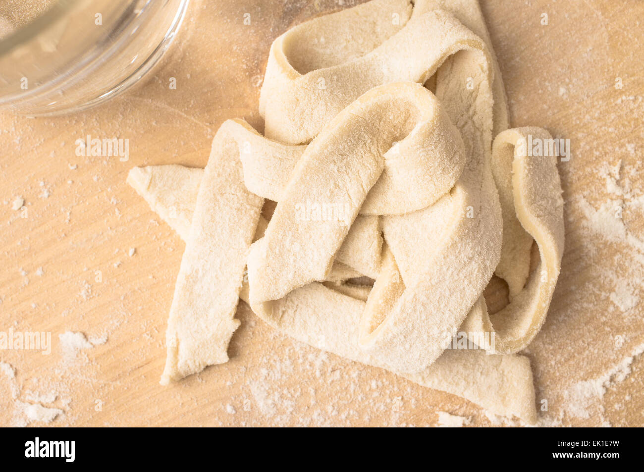 Strips of dough cooked pasta in homework Stock Photo