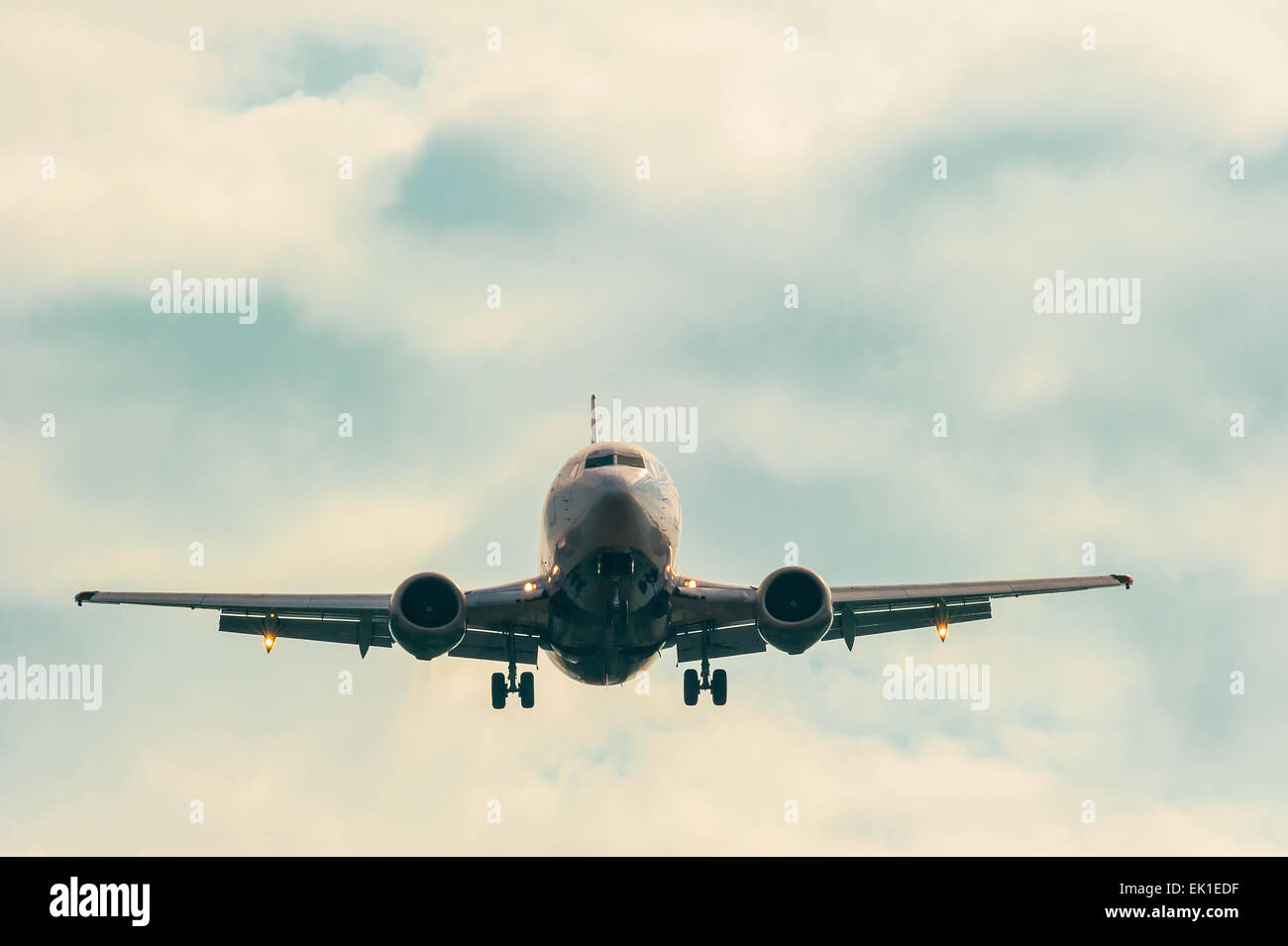 moving passenger plane in the sky Stock Photo