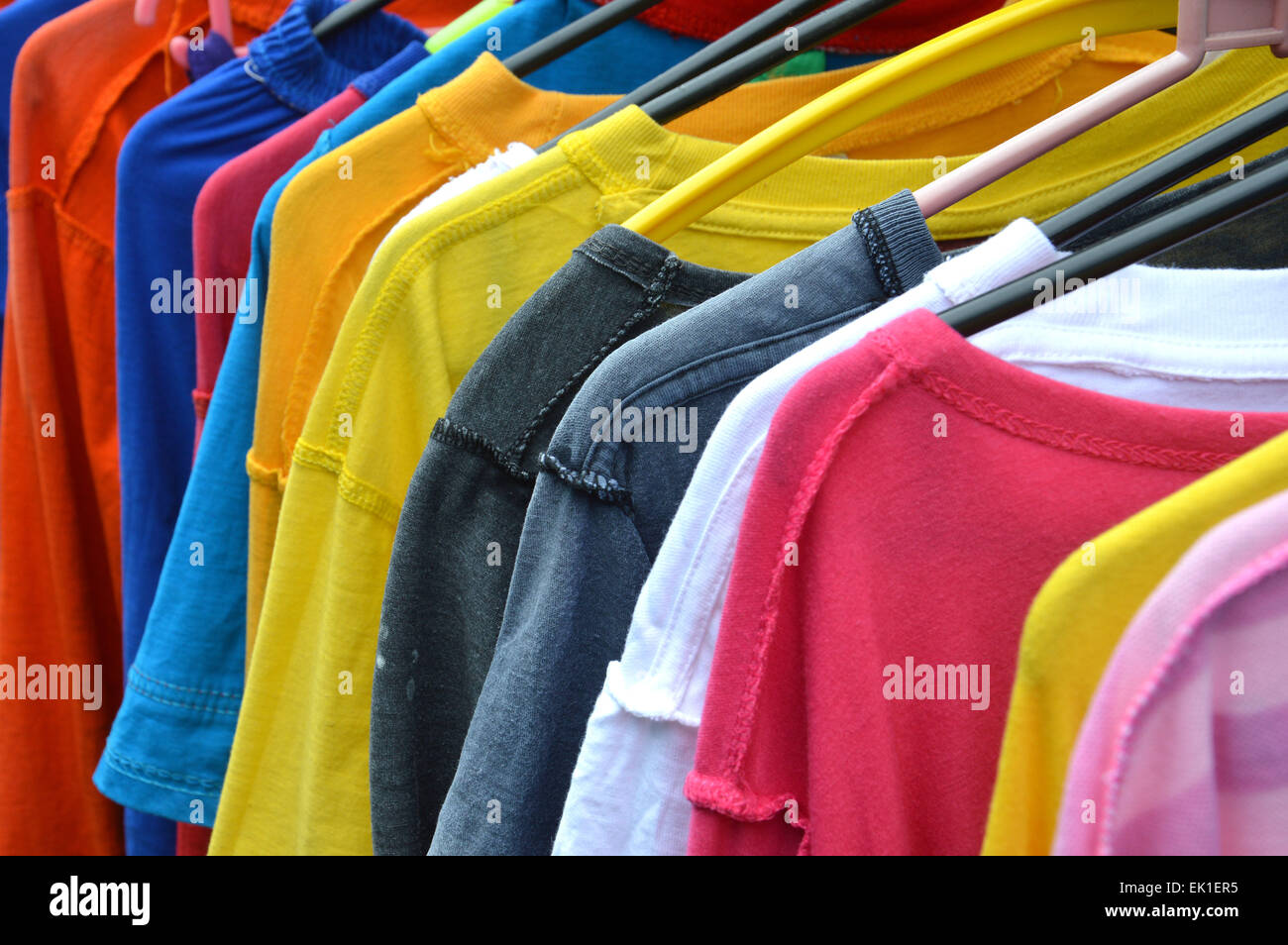 T-shirts drying on hangers Stock Photo - Alamy