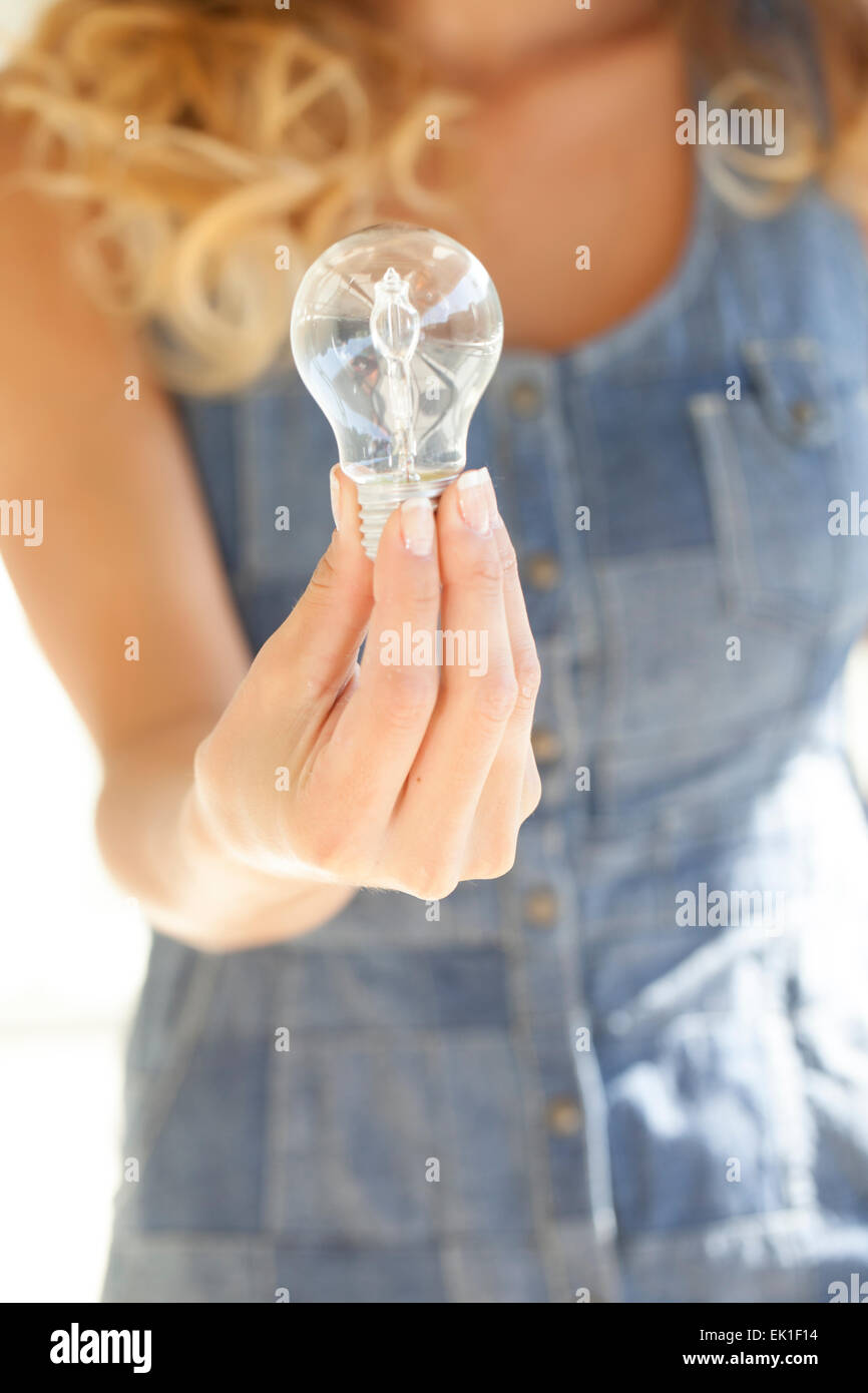 Light bulb in hands of a woman Stock Photo Alamy