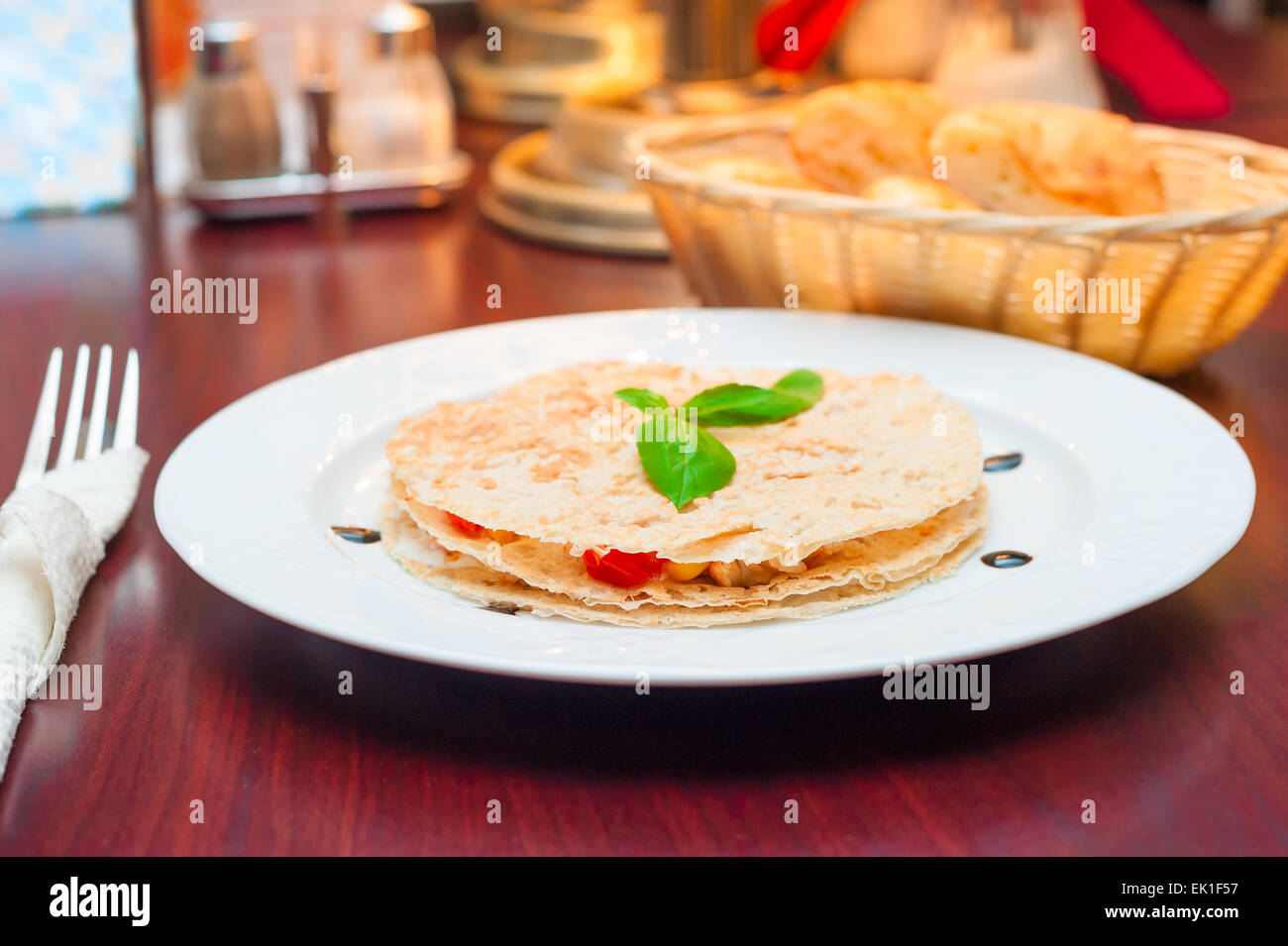 beautiful and tasty quesadilla with chicken in a restaurant Stock Photo