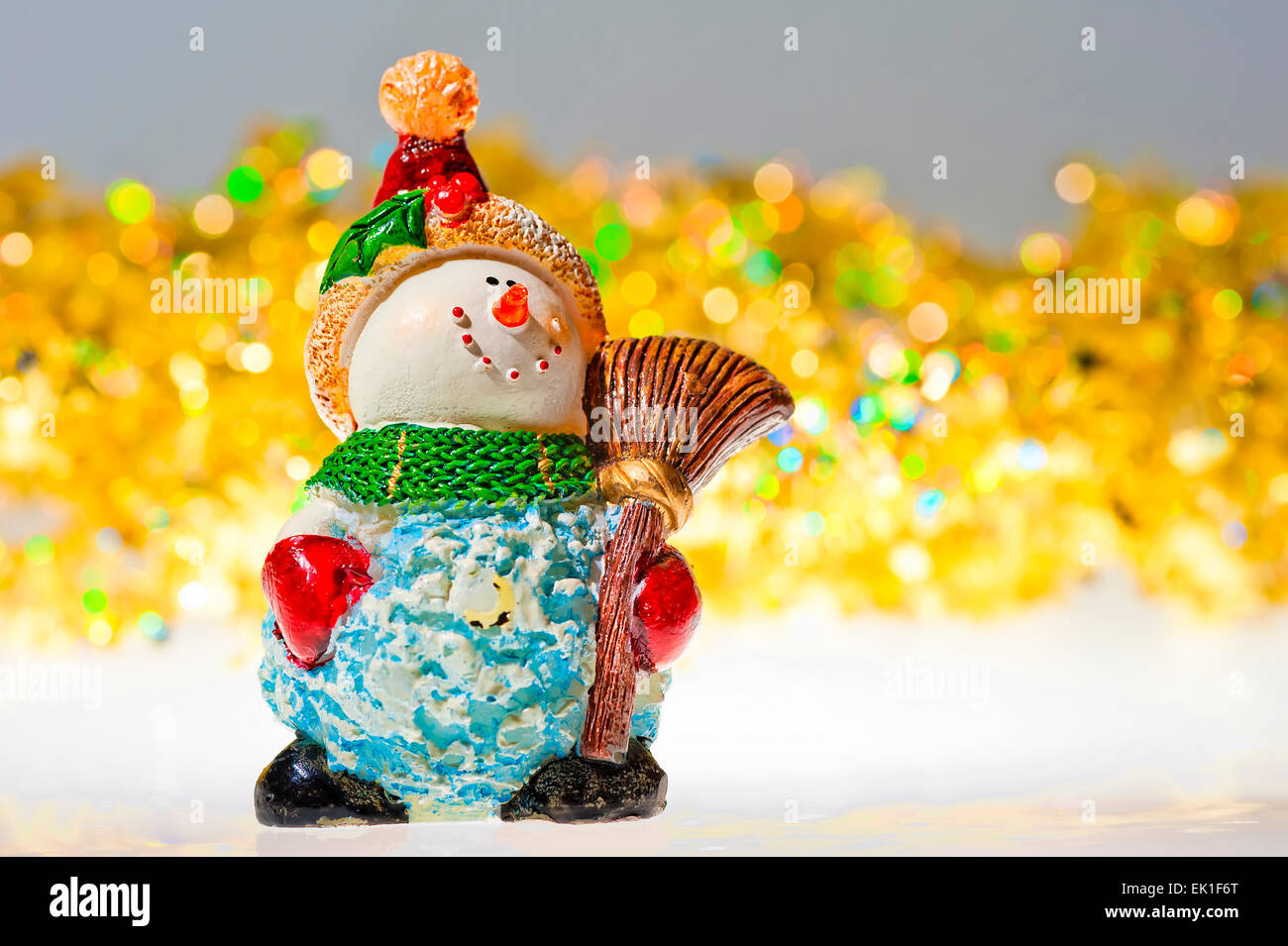 figurine snowman and tinsel - decorations for Christmas Stock Photo
