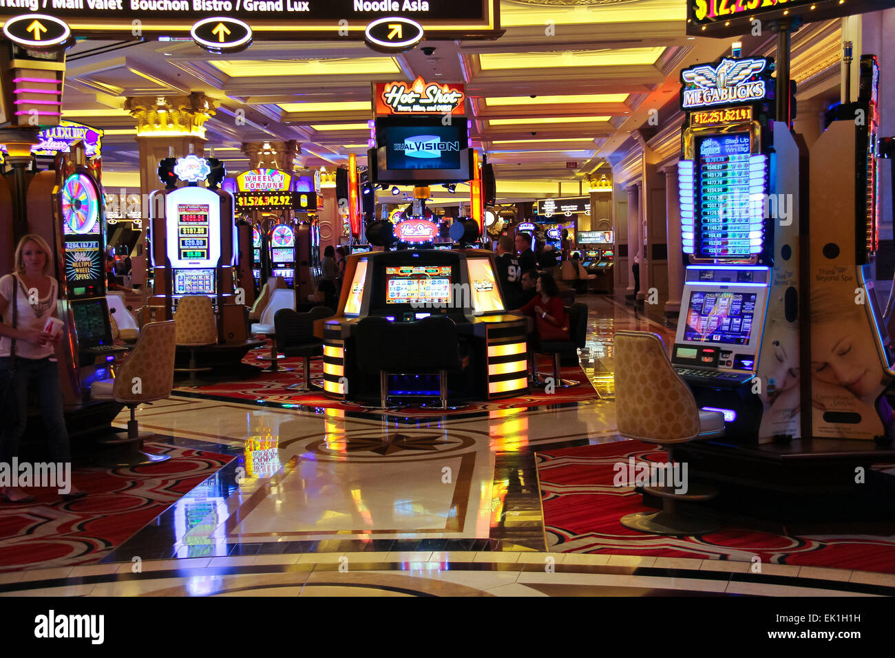 Las Vegas, NV, USA - 13th July 2013: People Playing Slot Machine Games  Inside Las Vegas Casino. Stock Photo, Picture and Royalty Free Image. Image  26254649.