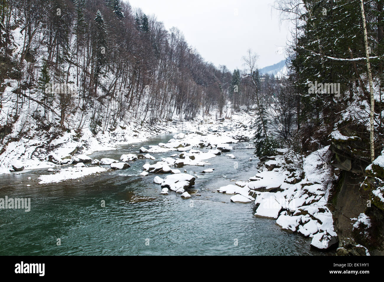 Winter mountain landscape with river and forest, Prut river in Carpathians, Ukraine Stock Photo