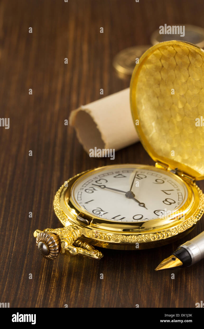 old pocket watch on wooden background Stock Photo