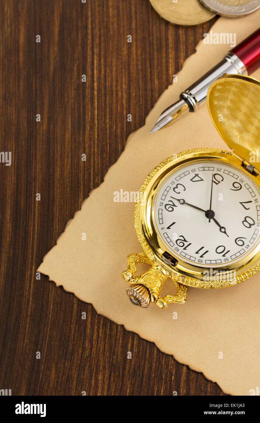 old pocket watch on wooden background Stock Photo