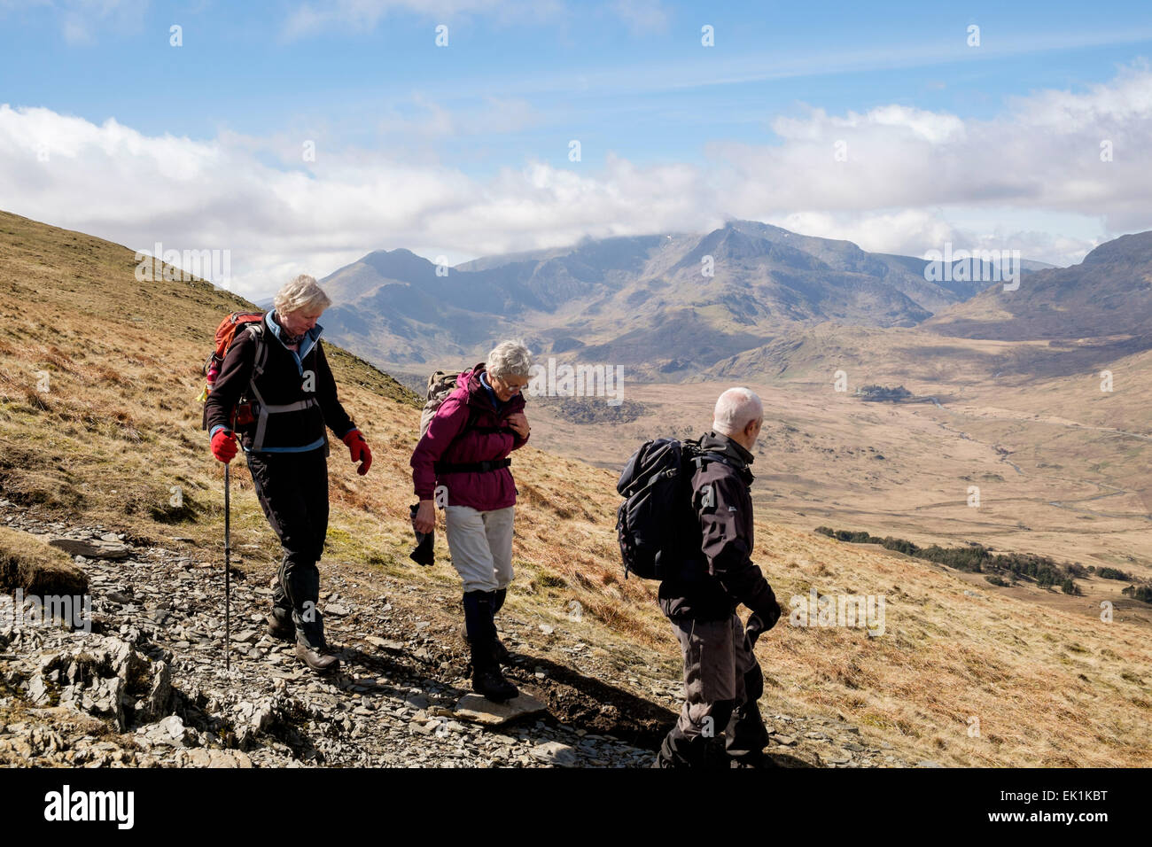 Wales, UK. Saturday 4th April 2015. Hikers enjoy glorious walking weather with clear views to Mount Snowdon Horseshoe in mountains of Snowdonia National Park. Capel Curig, Conwy, Wales, UK, Britain. Sunshine and blue skies are a welcome change from the recent weather conditions. Credit:  Realimage/Alamy Live News Stock Photo