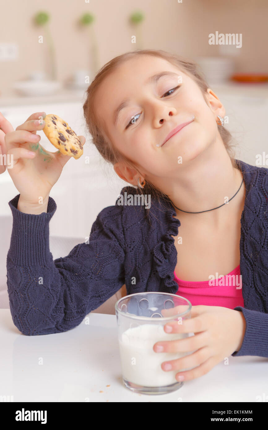 Kids drink milk and biscuits Stock Photo Alamy