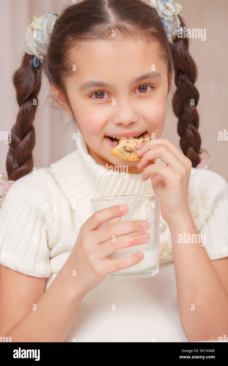 Kids drink milk and biscuits Stock Photo Alamy