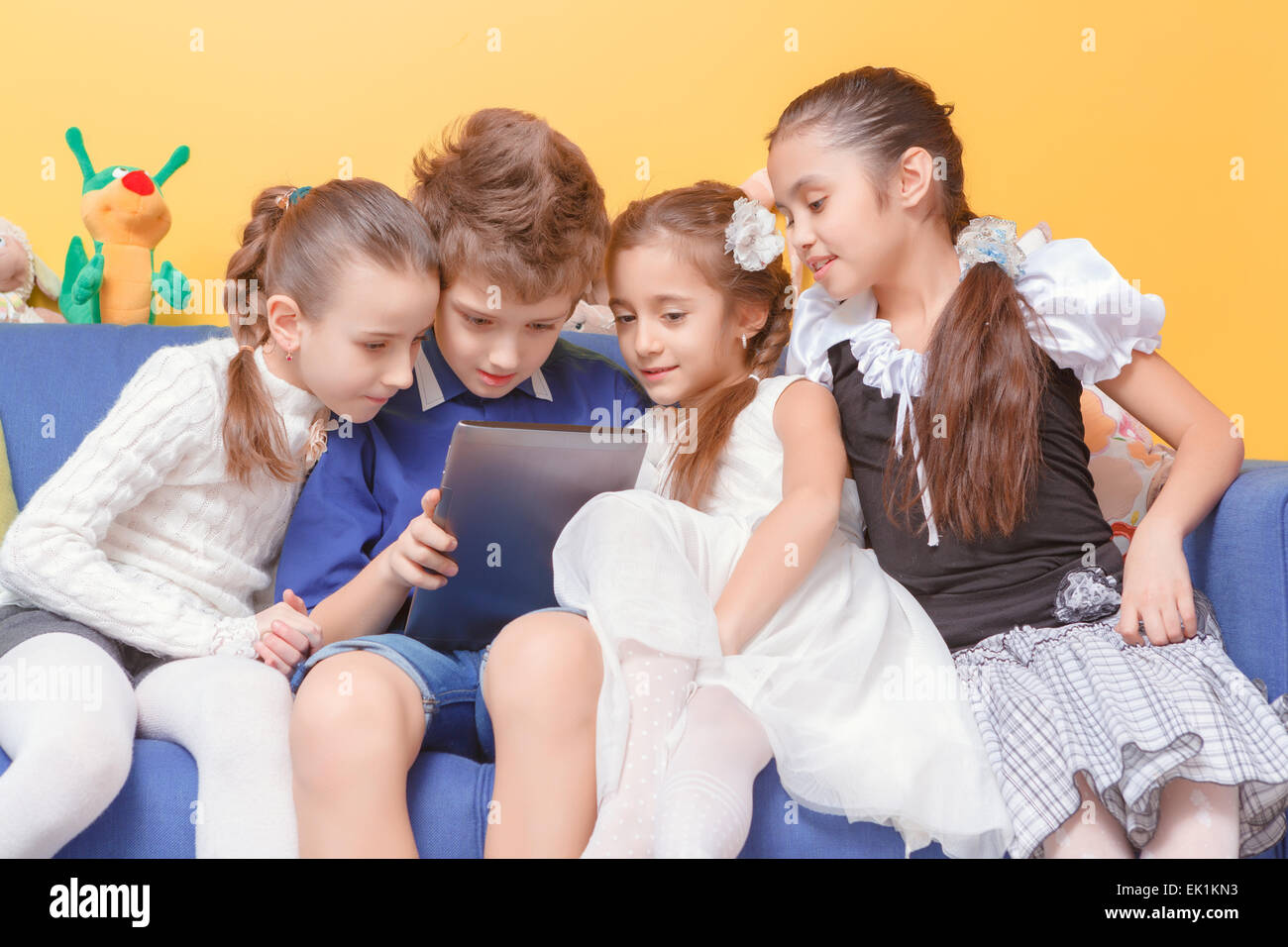 Kids use tablet device Stock Photo