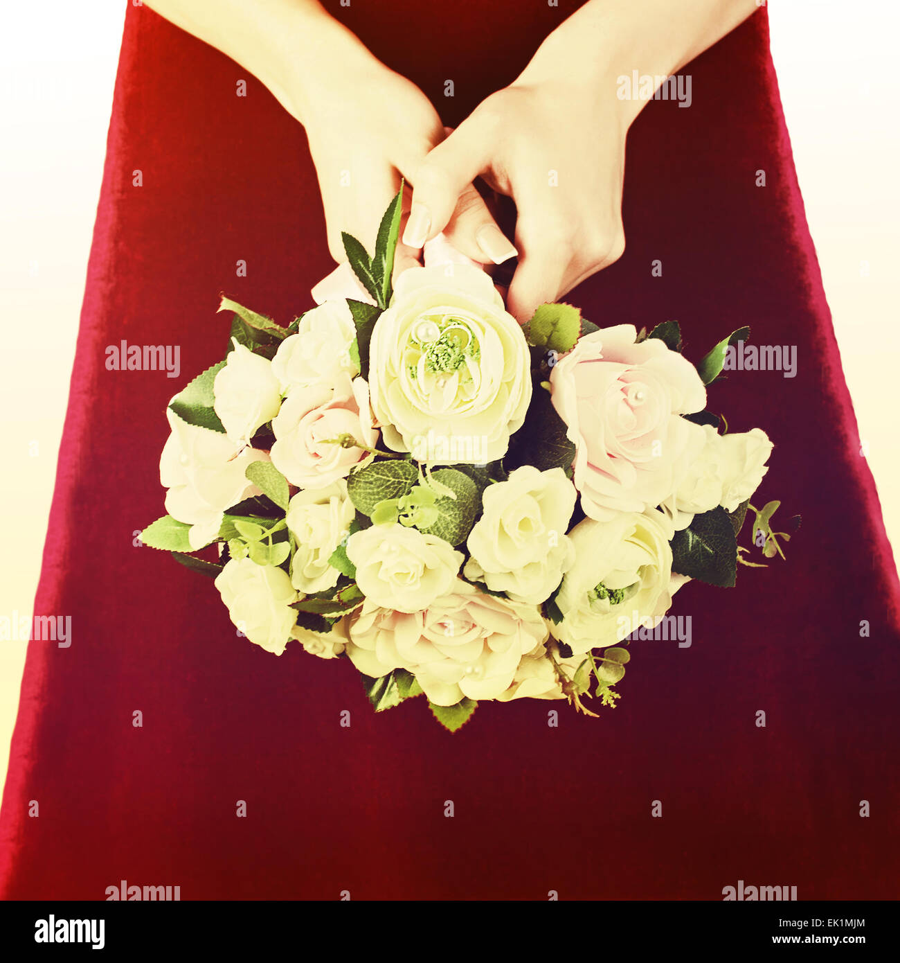 Beautiful wedding bouquet from white and pink roses in hands of bride ...