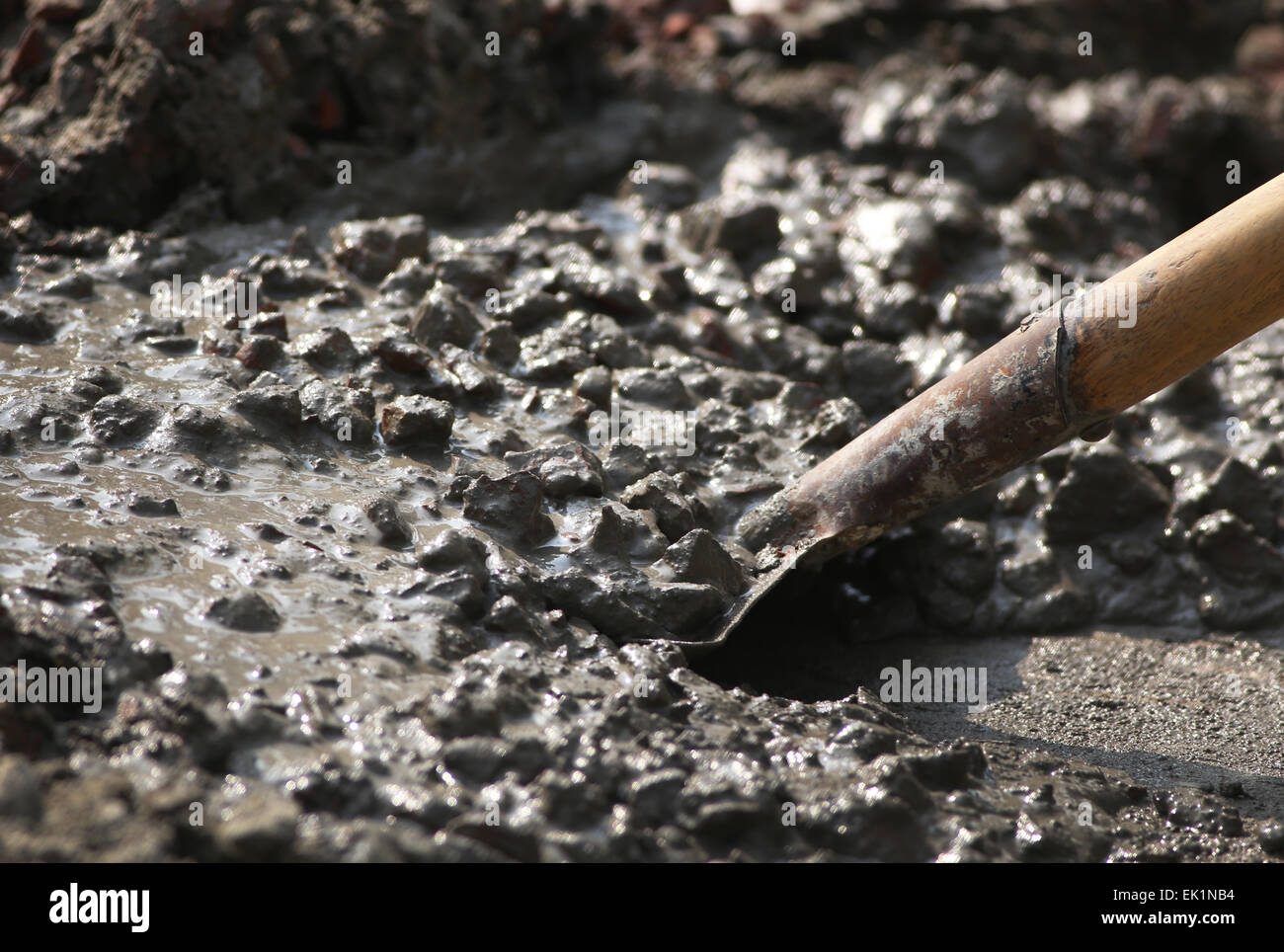 Concrete mixture with shovel for construction Stock Photo - Alamy